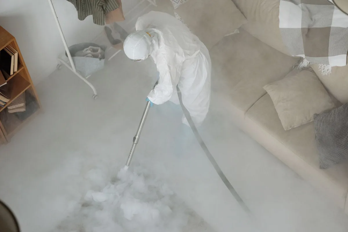 Biohazard cleanup technician in protective equipment, Chinook, MT